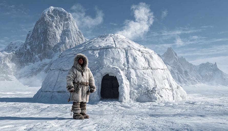 Eskimak stojí pred iglu v Antarktíde
